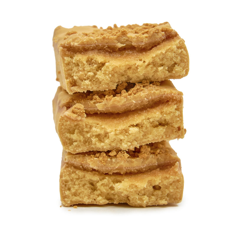 A stack of Mountain Joe's Caramel Biscuit Protein Bars