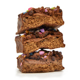 A stack Mountain Joe's Chocolate Candy Cream Protein Bars